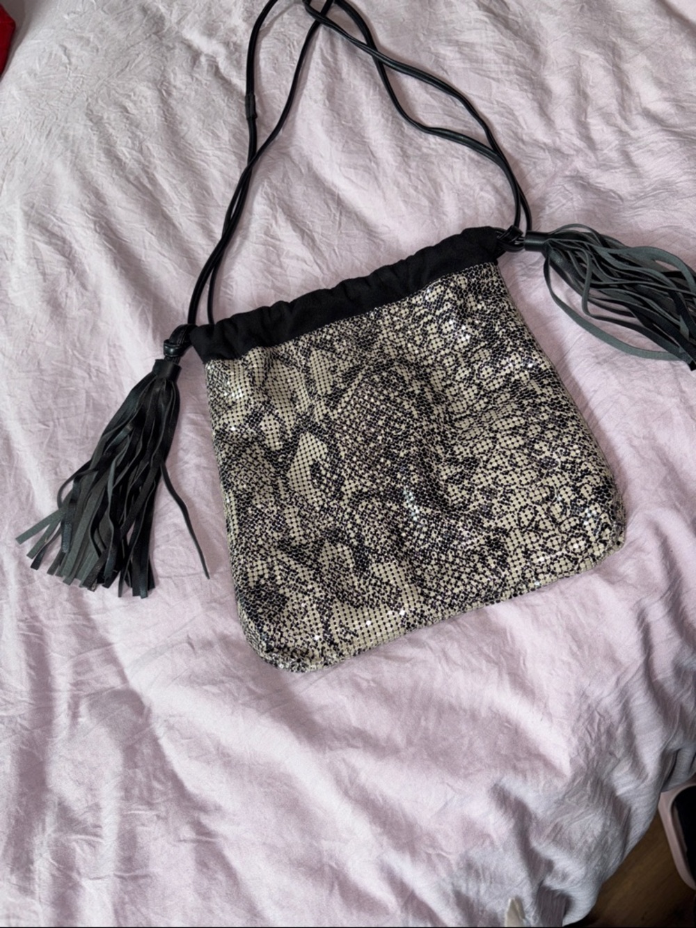 Sondra Roberts Black and Beige Snake-Print Drawstring Crossbody with Tassels